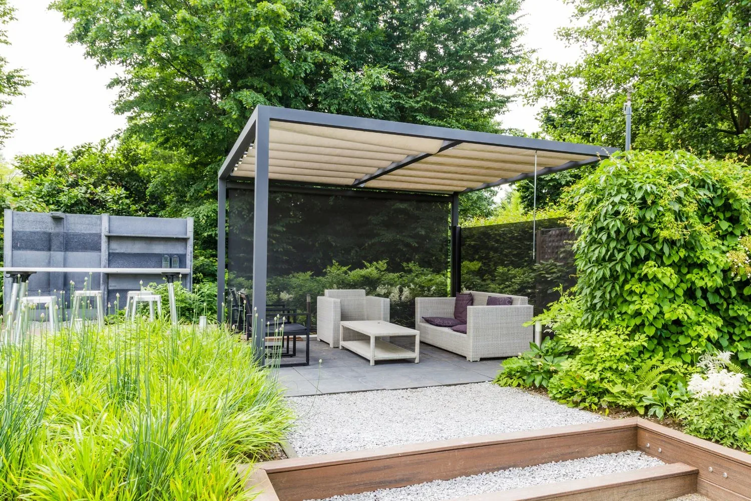 Modern louvered-roof pergola over a paved seating area